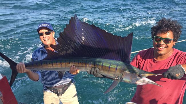 Brian Caruthers, pictured here with deckie Rueben Raymond, also fished with Darwin Bluewater Charters and caught this ripper sailfish.