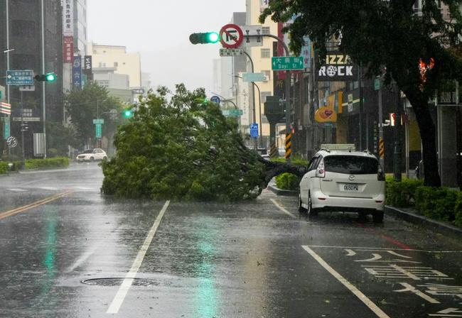 Torrential rain and powerful winds unleashed on the island have already left at least two people dead, two missing and 123 injured