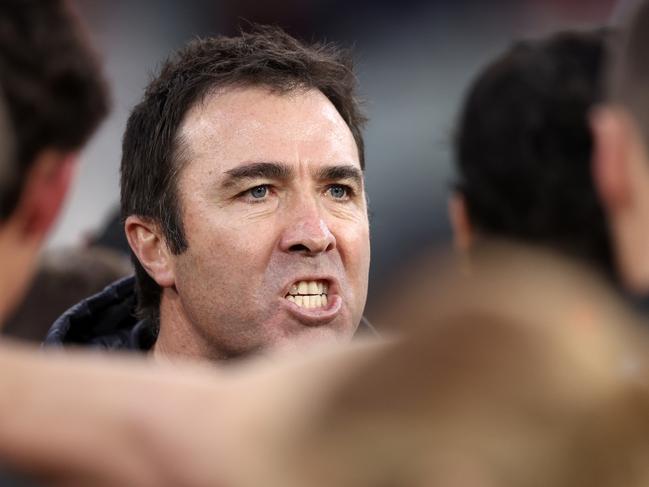 Brad Scott was looking fired up in the huddle! It’s no surprise the Bombers have rallied given the spray that was waiting for them. (Photo by Martin Keep/AFL Photos/via Getty Images)