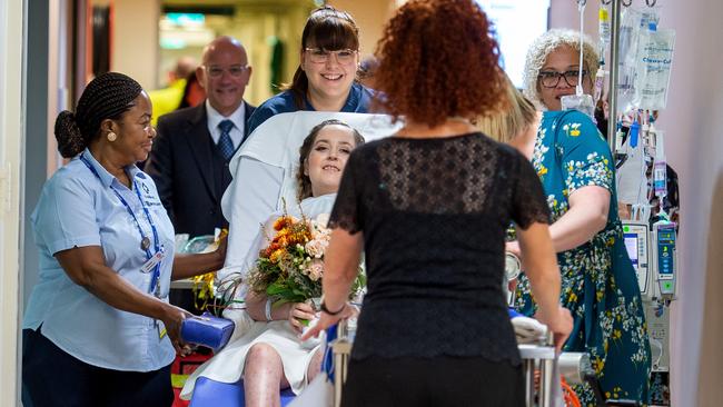 Toni is wheeled from ICU to the chapel to marry Jesse. Picture: Jay Town