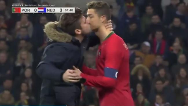 Cristiano Ronaldo gets up close and personal with a fan.