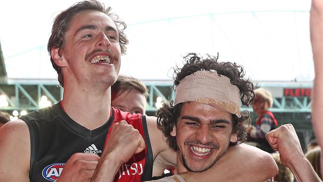 Jake Long, Joe Daniher and the Bombers walk to the rooms after winning. (Photo by Scott Barbour/Getty Images)