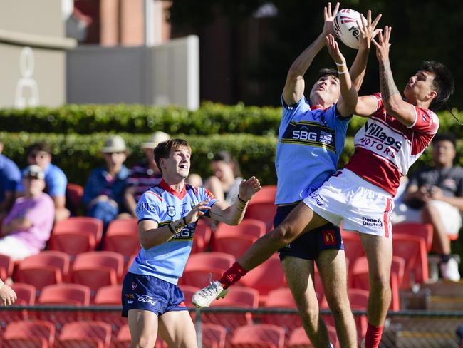 Ethan Brose of Western Clydesdales and Logan Hudson (right) of Brisbane Dolphins compete for possession in Mal Meninga Cup round 2 Queensland Rugby League at Toowoomba Sports Ground, Saturday, February 22, 2025. Picture: Kevin Farmer