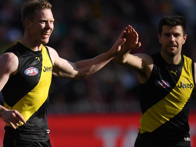 Jack Riewoldt (left) and Trent Cotchin celebrate a goal on Sunday. Picture: AAP Images