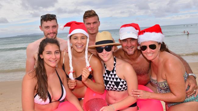 Claudia Ruffin, Tom Coates, Ellodie Ruffin, Sam Robinson, Brittany Ruffin, Wade Ruffin and Jill Ruffin on Noosa Main Beach enjoying Christmas Day.