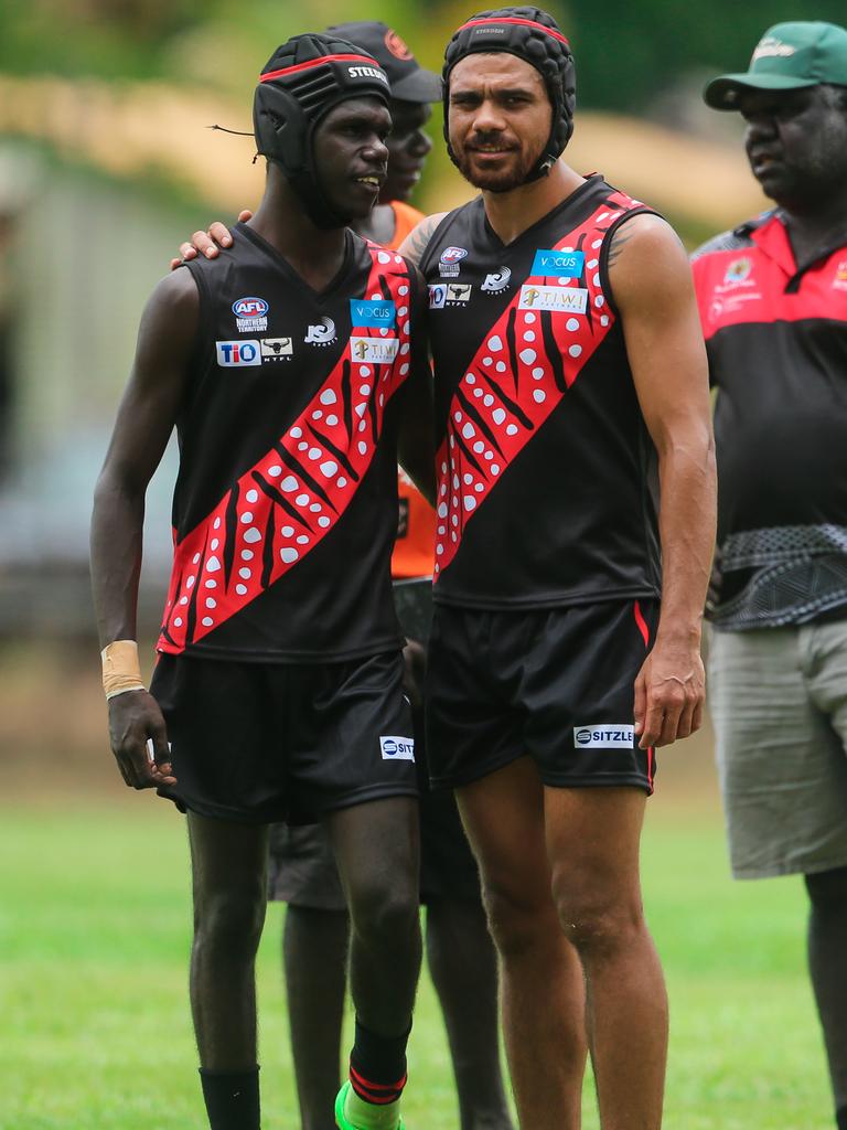 Rioli with a young teammate.