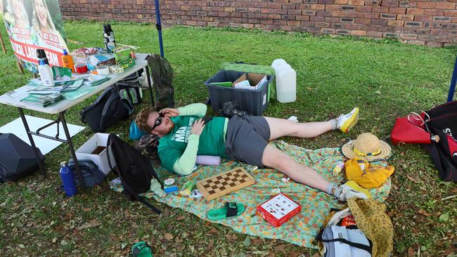 A volunteer takes a break in Bulimba. Picture: NewsWire / Tertius Pickard
