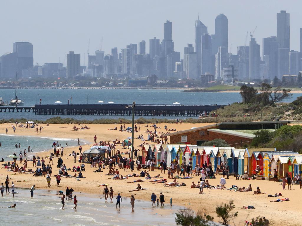  Beachgoers see out 2019 of New Years Eve at the Brighton sea boxes in Melbourne. Picture: Aaron Francis/The Australian