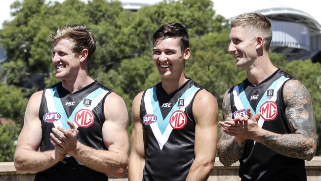 Hartlett with captain Tom Jonas and Connor Rozee. Picture: Sarah Reed