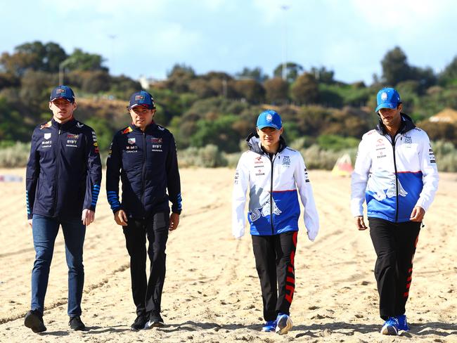 The Red Bull drivers enjoy a walk on the sand. Picture: Getty