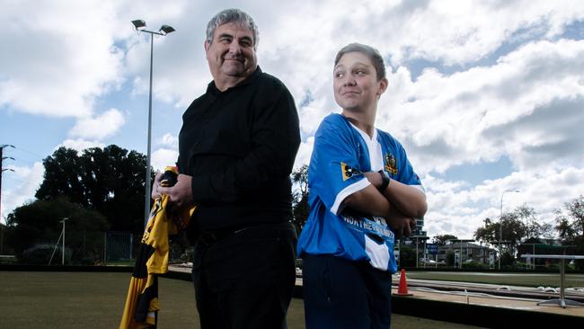 Scott Hocking with son Cooper at the Adelaide Bowling Club. Picture: AAP Image/Morgan Sette.