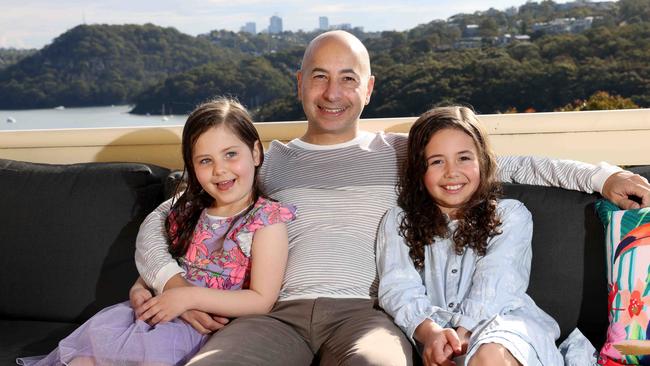 Mike Cohen, with his kids Sophie, 8, and Skyler, 5, is combating rising prices. Picture: Damian Shaw