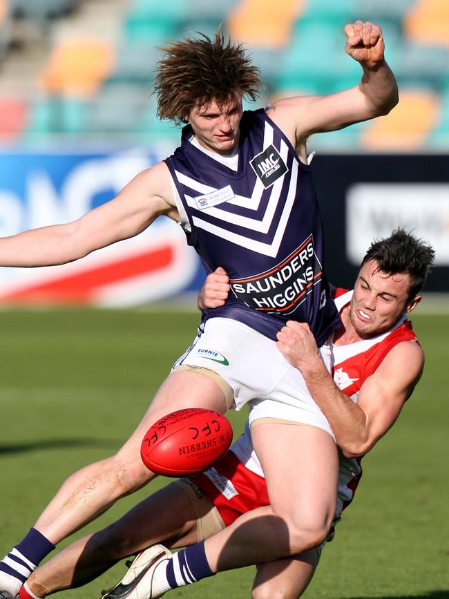 Brody Mihocek (front) playing for Burnie against Clarence in the Tasmanian State League at Blundstone Arena.