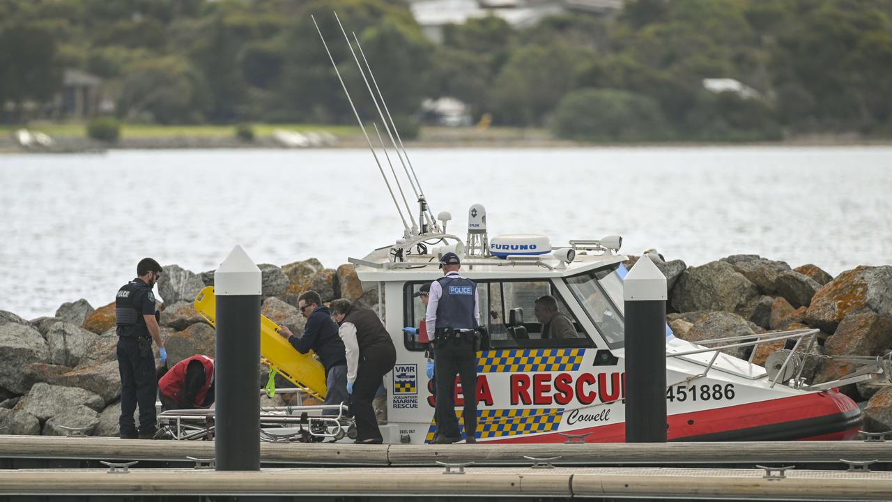Rescue teams worked to bring the bodies of those killed in the tragic incident back to shore. Picture Mark Brake