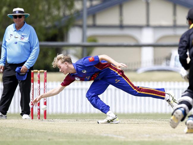 Northern District bowler Oliver Makin stops the ball. Picture: John Appleyard