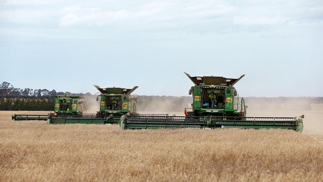 Combine harvesters work a past year’s harvest. Picture: Andy Rogers