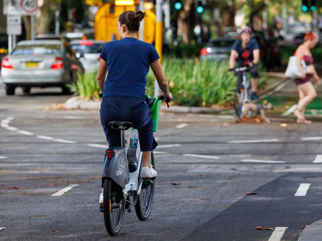 People using lime bikes without helmets, in Surry Hills, on Wednesday 12, March. Picture: Justin Lloyd.