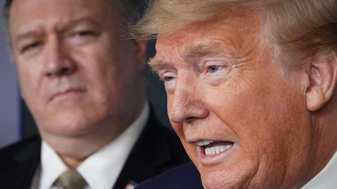 Then US Secretary of State Mike Pompeo watches then US president Donald Trump speak during the daily briefing on Covid-19 on April 8, 2020. Picture: Mandel Ngan/AFP