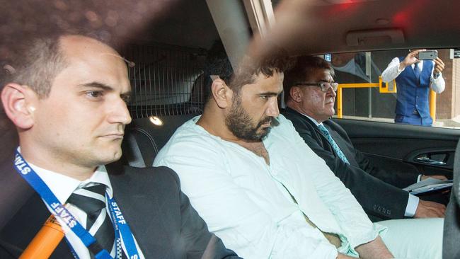 Accused Flinders Street rampage driver Saeed Noori (centre) leaves the Melbourne West Police Station on Saturday. Picture: Mark Stewart.