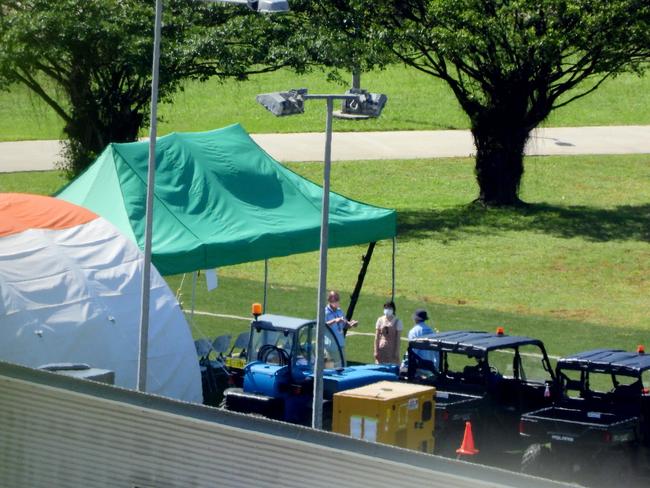 AUSMAT interact with Australian evacuees inside the detention centre on Christmas Island. Picture: Nathan Edwards