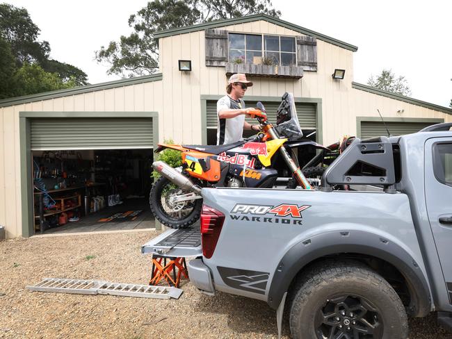 Daniel 'Chucky' Sanders straps on his winning KTM bike to his Nissan Navara to head out for a ride around the apple orchard. Picture: David Caird