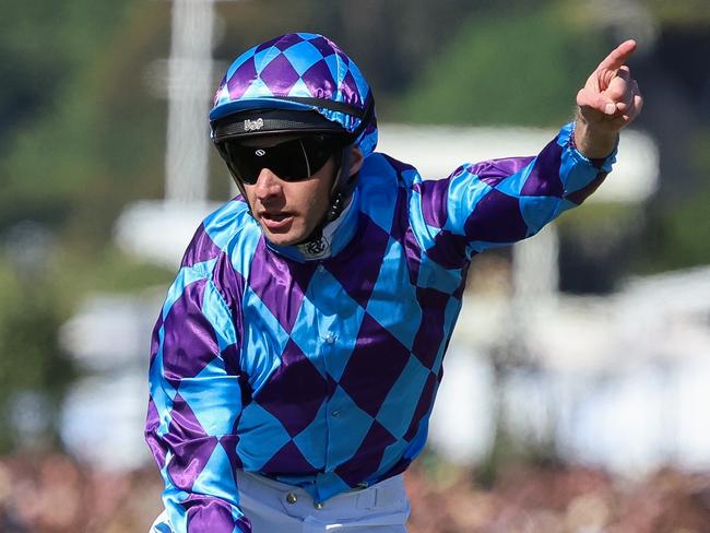 MELBOURNE, AUSTRALIA - NOVEMBER 11: Jockey Declan Bates riding Pride Of Jenni wins Race 7 the Kennedy Champions Mile during Stakes Day at Flemington Racecourse on November 11, 2023 in Melbourne, Australia. (Photo by Asanka Ratnayake/Getty Images)