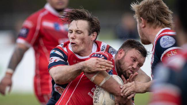 Eagles lock Brett Lahey tackled by Toby Huxley.