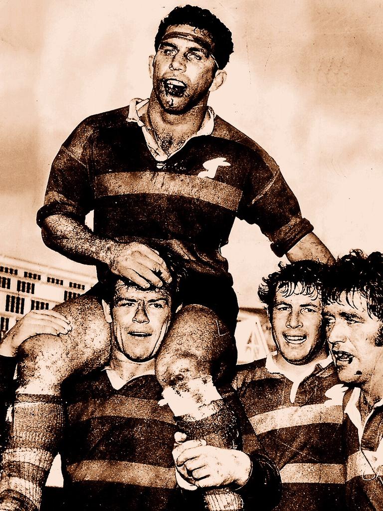 John Sattler chaired from the field with a broken jaw by Bob McCarthy, Mike Cleary and John O'Neill after the 1970 grand final.