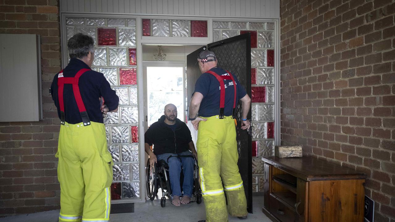 CFA volunteers check on Kalorama resident Aaron Wake. Picture: Arsineh Houspian