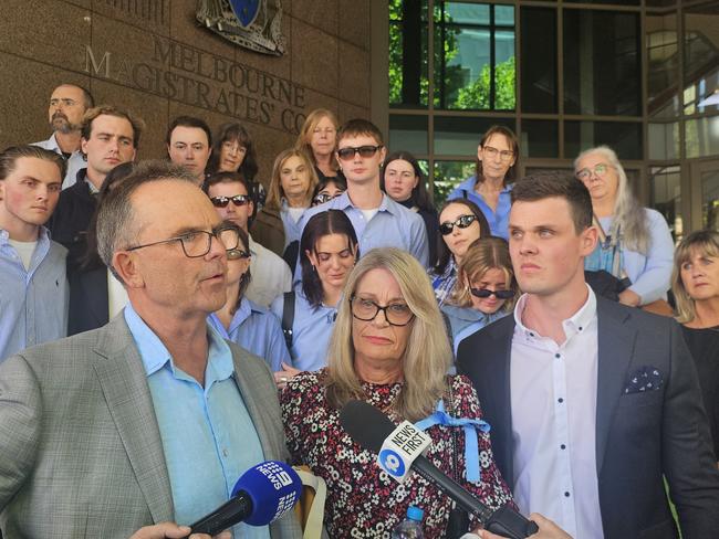 Ms Hodder’s parents, Pauline and Michael, and their supporters dressed in blue in memory of the young model. Picture: Supplied