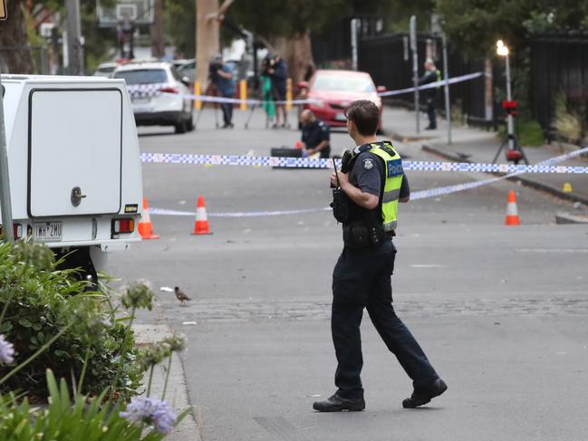 Police tape off Palmer St after the shooting, which took place about 1am. Picture: David Crosling