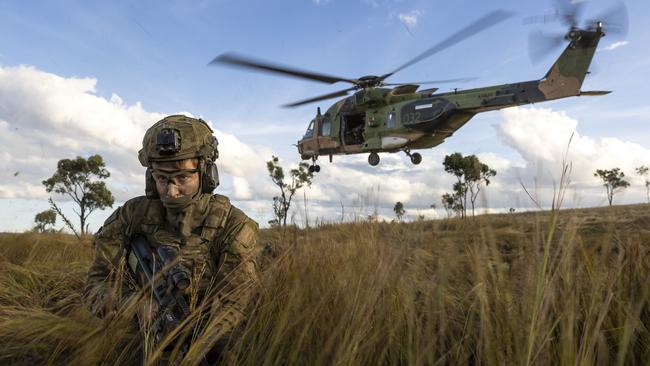 Soldiers from the 4th Regiment, Royal Australian Artillery and 3rd Battalion, The Royal Australian Regiment dismount from an MRH-90 Taipan during Exercise Chau Pha in Townsville Field Training Area, Queensland. *** Local Caption *** Soldiers from the 3rd Brigade’s 4th Regiment, Royal Australian Artillery and 3rd Battalion, The Royal Australian Regiment deployed to the Townsville Field Training Area for Exercise Chau Pha in June 2023. Exercise Chau Pha provides dynamic and technical training to ensure the Regiment is proficient in coordinating offensive support in the battlespace. The Regiment has now successfully prepared and certified for their participation in the upcoming Exercise Talisman Sabre, where they will integrate as the 3rd Combat Brigade’s organic Fire Support.