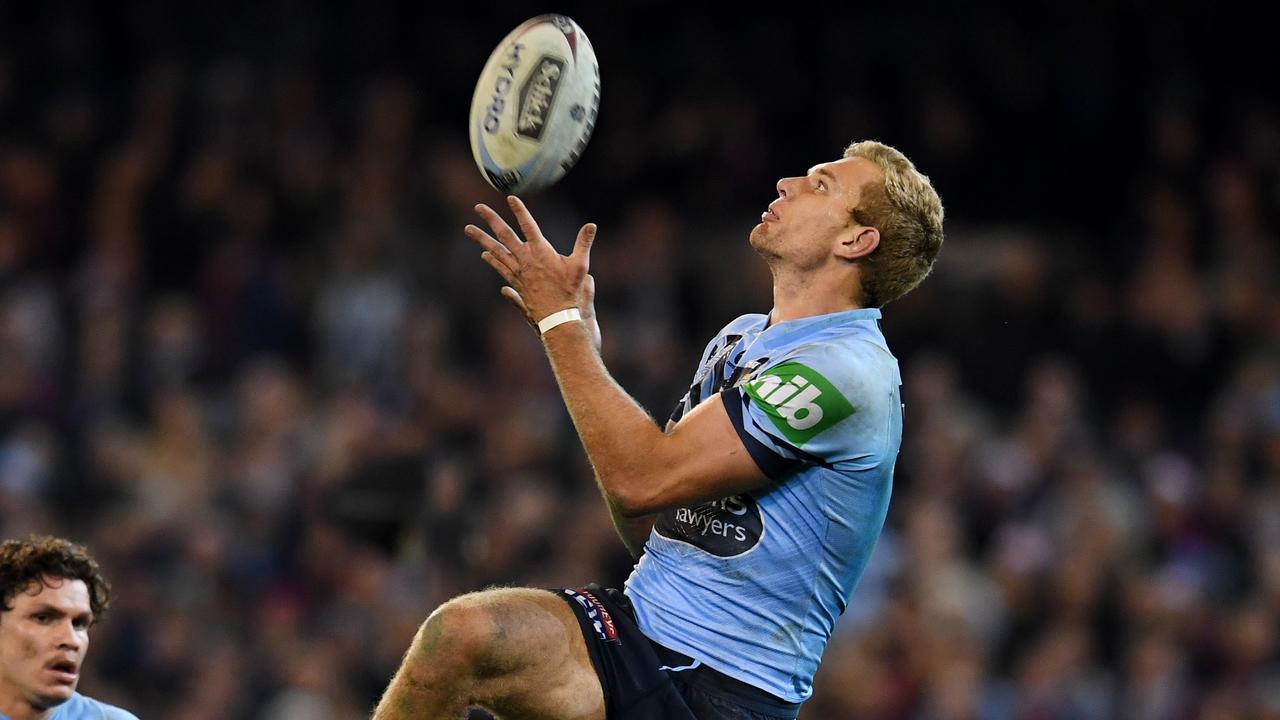 Tom Trbojevic of the Blues catches a high Queensland kick during Origin I.