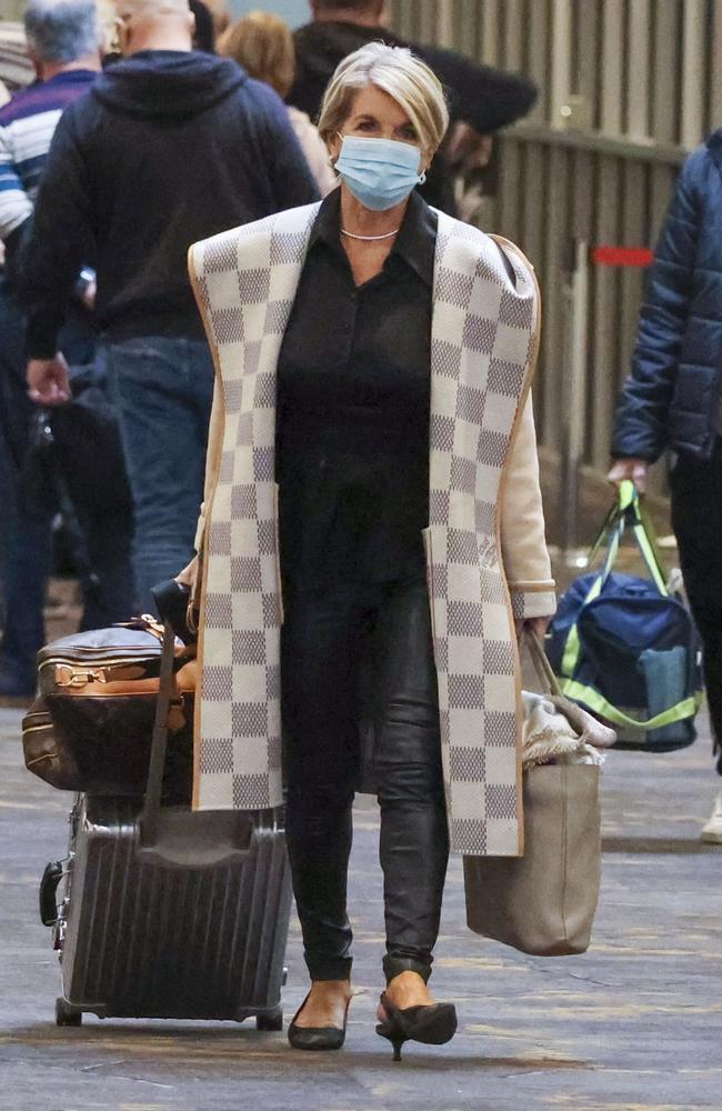 Julie Bishop puts her best fashion foot forward at Melbourne Airport wearing a $8,250 Louis Vuitton coat. Picture: Media Mode