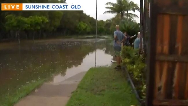 Coolum residents survey flooding which impacted their homes. Picture: Today, Channel 9