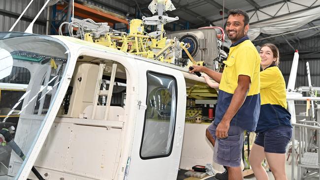 Engineer Paraveen Kamalapurkar with apprentice Brooklyn Holz working on a helicopter repair at Skytek in Cairns. Picture: Emily Barker.