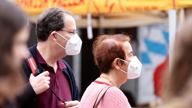 People wearing masks in Brisbane City yesterday. Picture: Steve Pohlner