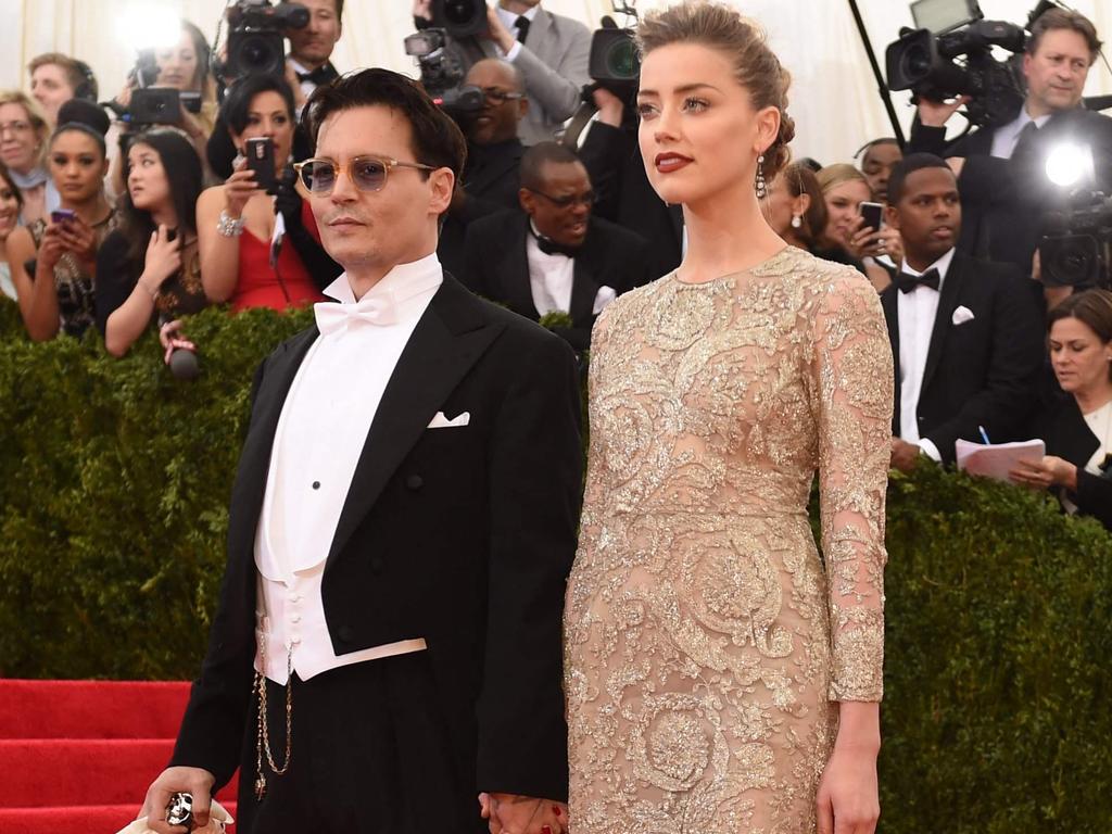 Johnny Depp and Amber Heard arrive at the Met Gala in 2014. She alleged he hit her afterwards. Picture: Timothy A. Clary/AFP