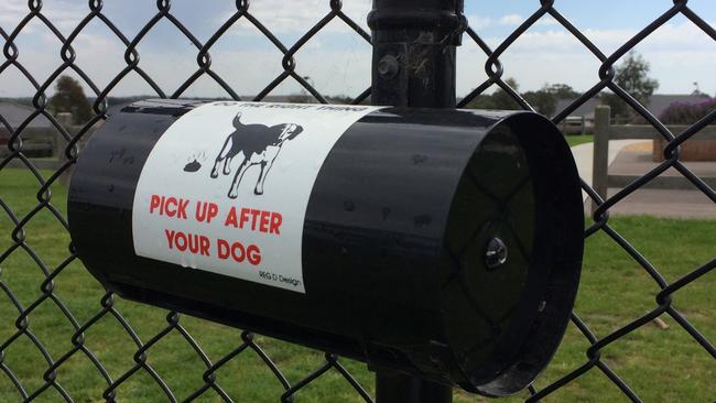 An empty dog-poo bag holder in Pasedena Estate in Clyde. Cranbourne leader