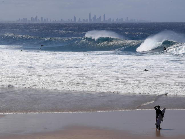 General view of surf at Snapper Rocks on the Gold Coast, Thursday, February 21, 2019. Huge swells and high tides are set to pummel south-east Queensland beaches over the coming days as Cyclone Oma tracks towards the Queensland coast (AAP Image/Dave Hunt) NO ARCHIVING
