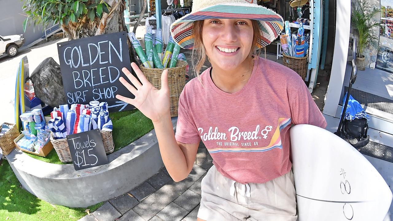 Golden Breed surf shop’s Paris Smith at the key shop entry to Hastings St. Photo: Patrick Woods