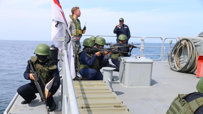 A Royal Australian Navy sailor provides training for Philippine Navy members, on board the patrol boat HMAS Wollongong. Picture: Department of Defence