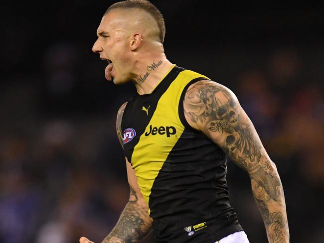 Dustin Martin of the Tigers reacts after kicking a goal during the Round 11 AFL match between the North Melbourne Kangaroos and the Richmond Tigers at Marvel Stadium in Melbourne, Friday, May 31, 2019. (AAP Image/Julian Smith) NO ARCHIVING, EDITORIAL USE ONLY