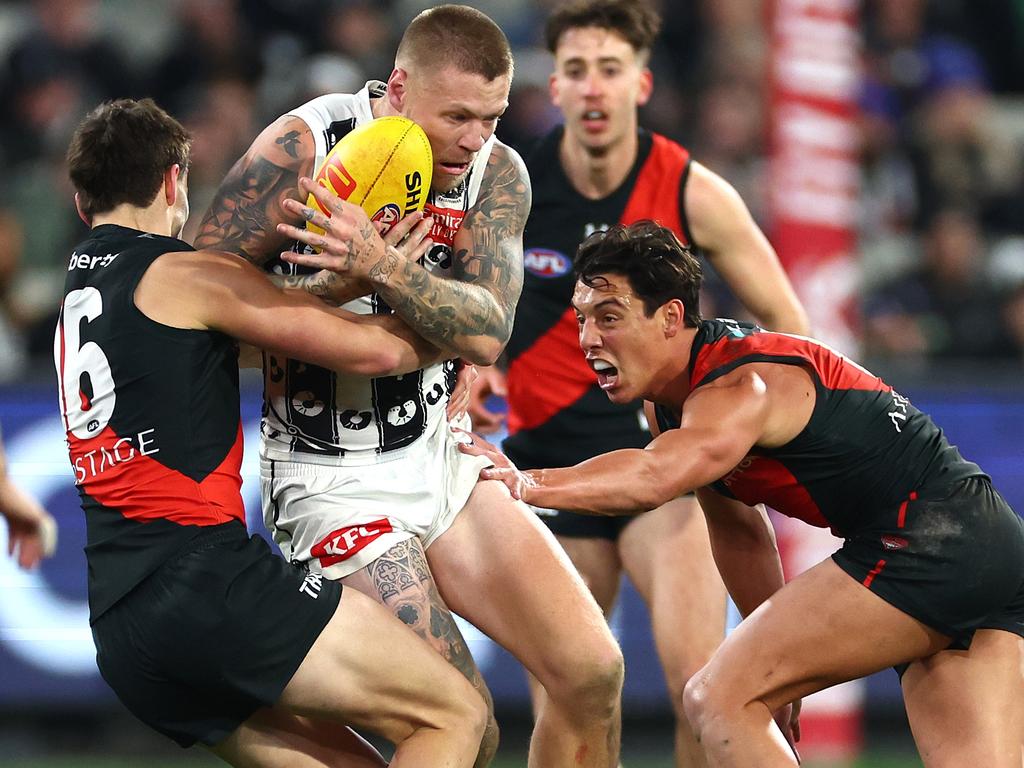 Jordan De Goey is tackled by Archie Perkins. Picture: Quinn Rooney/Getty Images