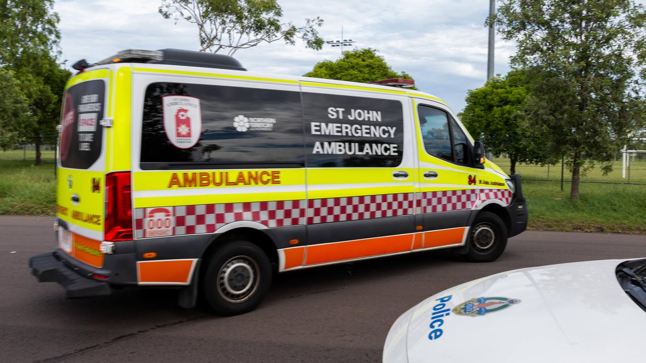 Car collides with power pole, stuck on rail line