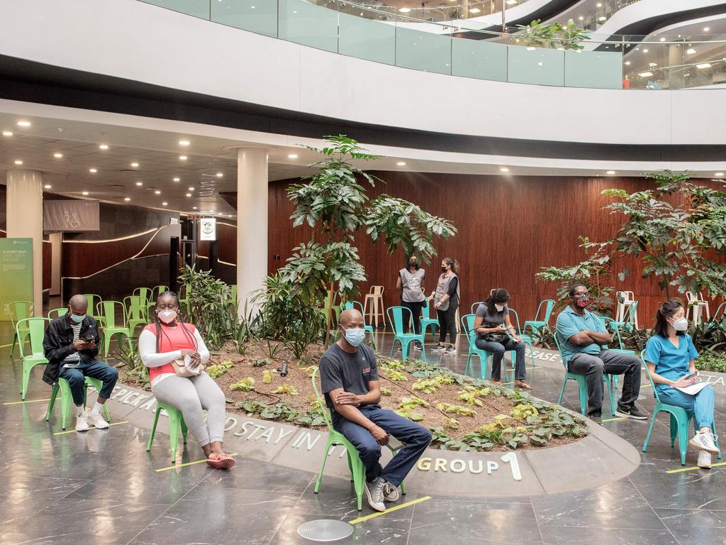 People wait to be vaccindated against Covid-19 at Discovery vaccination site in Sandton, Johannesburg. Picture: Luca Sola / AFP