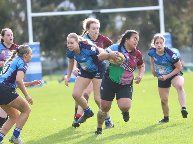 UniQueens forward Lolohea Foki breaks free against Taroona during their TRU womenâs clash at Rugby Park. Picture: CMW Photography