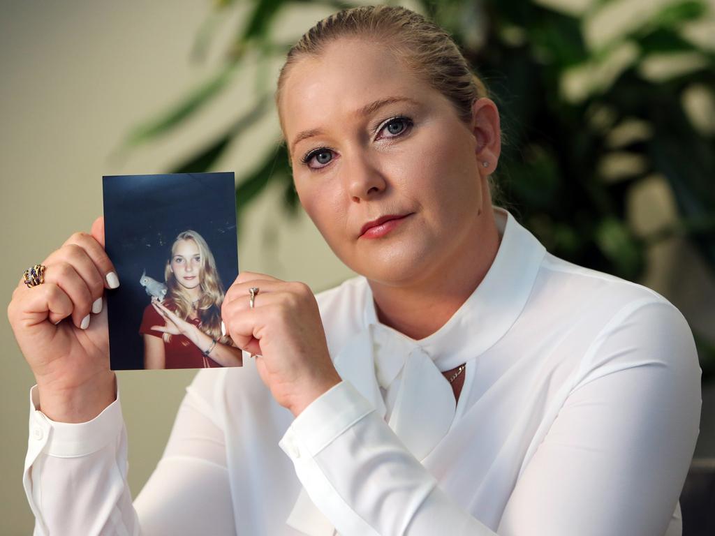 Virginia Roberts holds a photo of herself at age 16. Picture: Emily Michot/Miami Herald/Tribune News Service/Getty Images