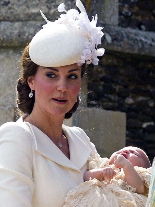 Catherine, Duchess of Cambridge, carries Princess Charlotte of Cambridge as they arrive at the Church of St Mary Magdalene on the Sandringham Estate for the Christening of Princess Charlotte of Cambridge on July 5, 2015 in King’s Lynn, England. Picture: Getty