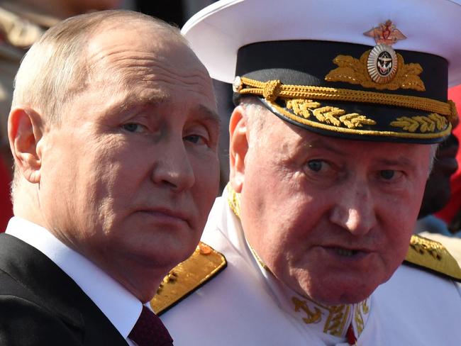 Russian President Vladimir Putin, accompanied by Commander-in-Chief of the Russian Navy, Admiral Nikolai Yevmenov, attends the Navy Day parade in Saint Petersburg on July 30, 2023. (Photo by AFP)